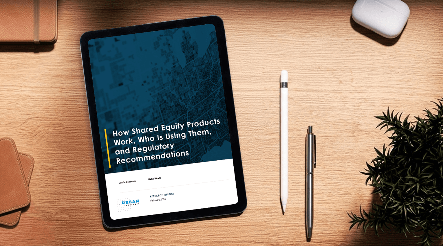 A tablet perched on a desk with Urban Institue's How Shared Equity Products Work, Who Is Using Them, and Regulatory Recommendations displayed on the screen.